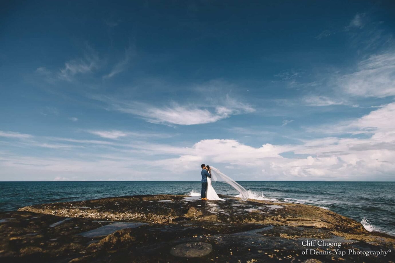 Malaysia Best Prewedding Destination Kota Kinabalu Engagement Photography Cliff Choong wedding photographer nature beach cloud blue sky kiss couple hug veil bridal gown