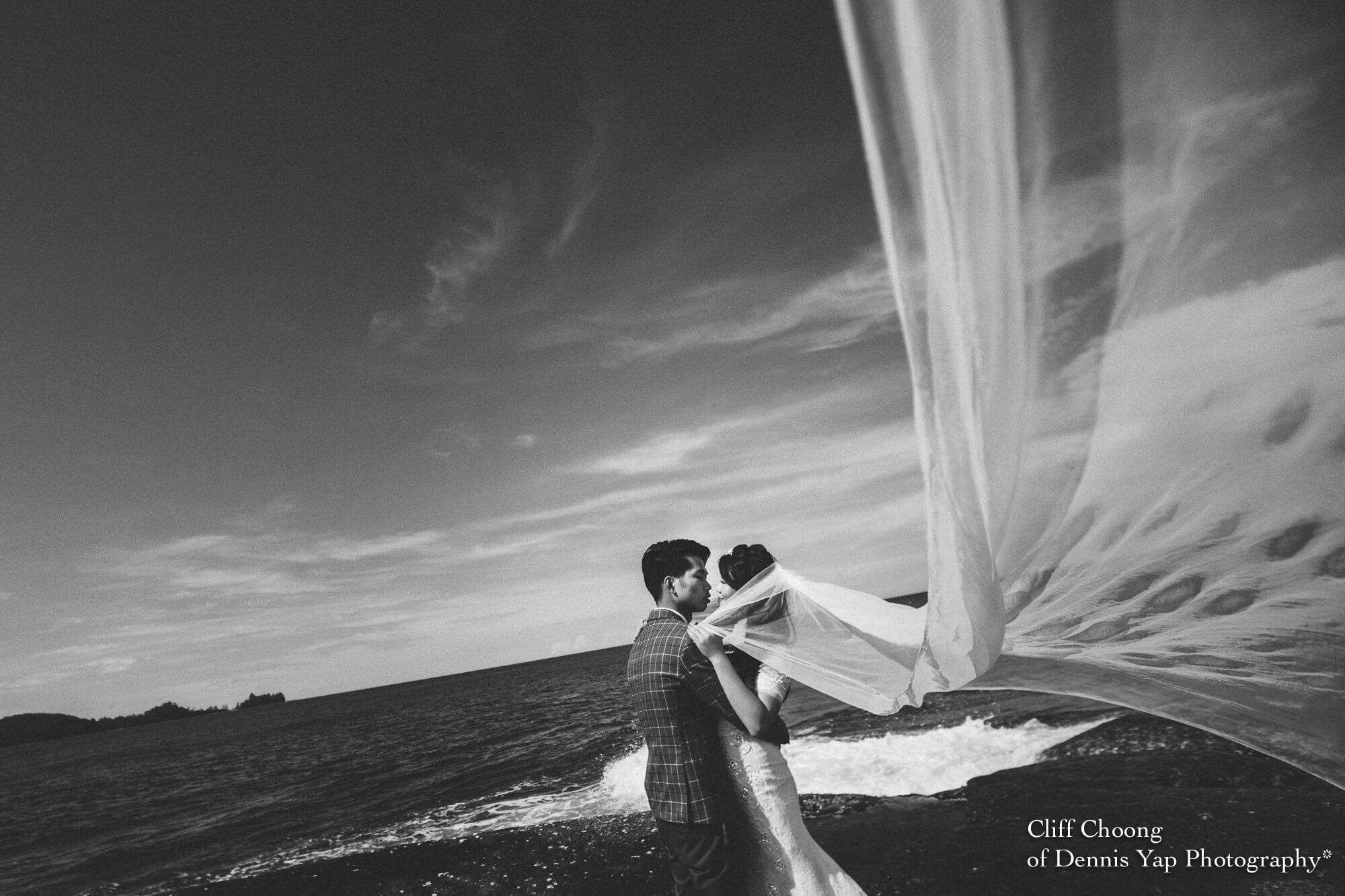 Malaysia Best Prewedding Destination Kota Kinabalu Engagement Photography Cliff Choong wedding photographer nature beach cloud blue sky kiss couple hug