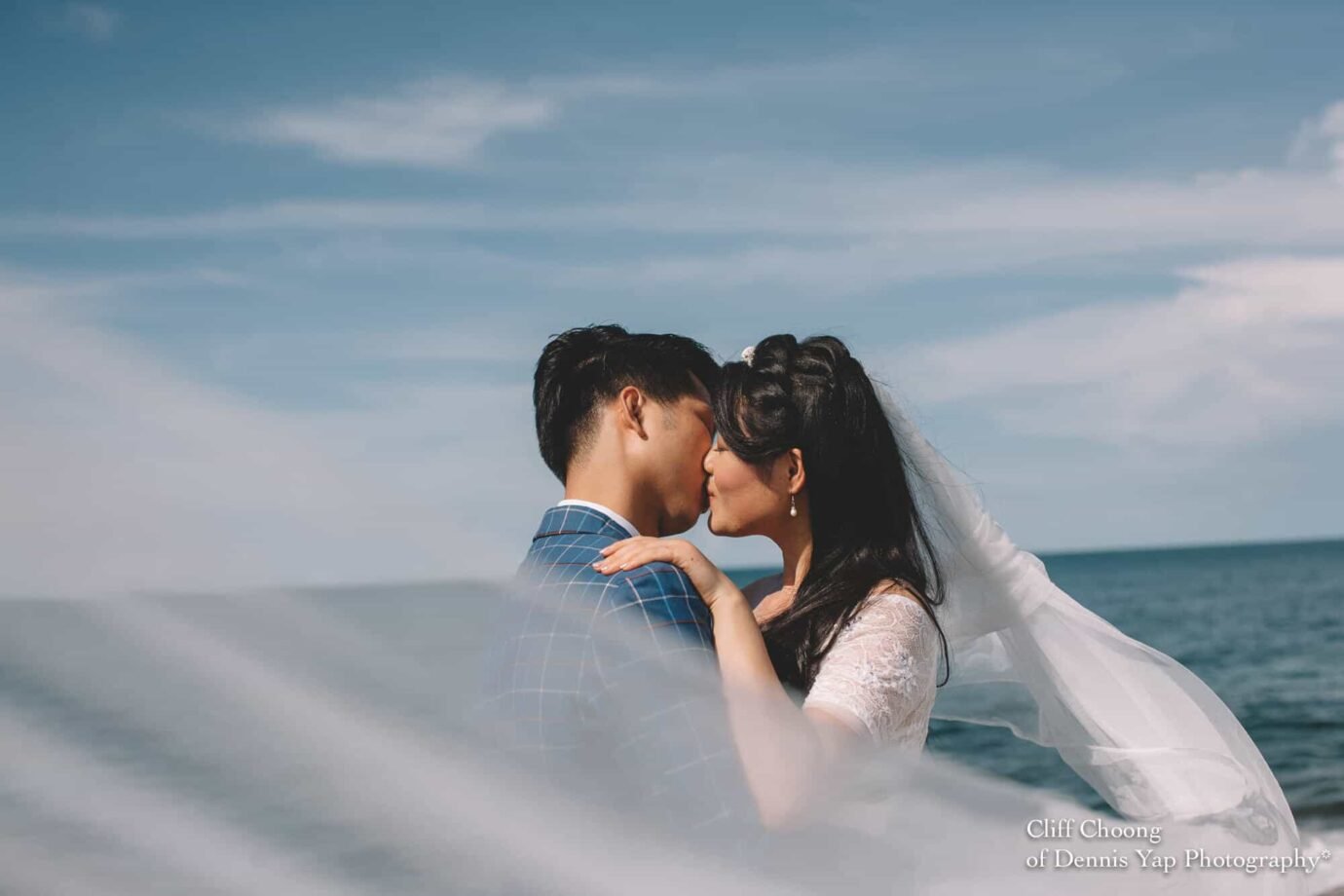 Malaysia Best Prewedding Destination Kota Kinabalu Engagement Photography Cliff Choong wedding photographer nature beach cloud blue sky kiss couple hug