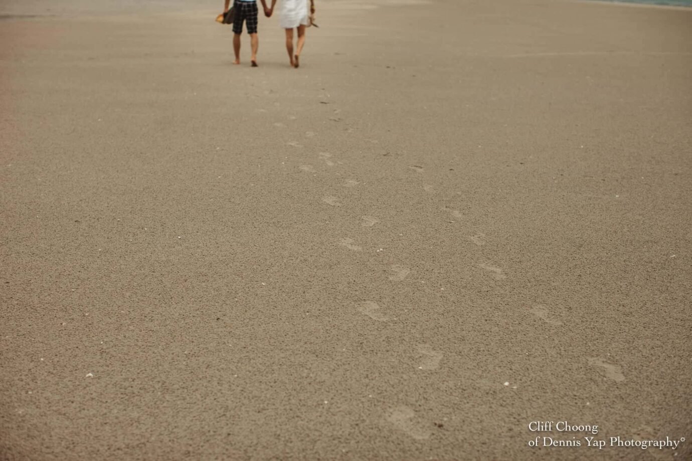 Malaysia Best Prewedding Destination Kota Kinabalu Engagement Photography Cliff Choong wedding photographer nature beach cloud blue sky kiss couple hug veil bridal gown footprint