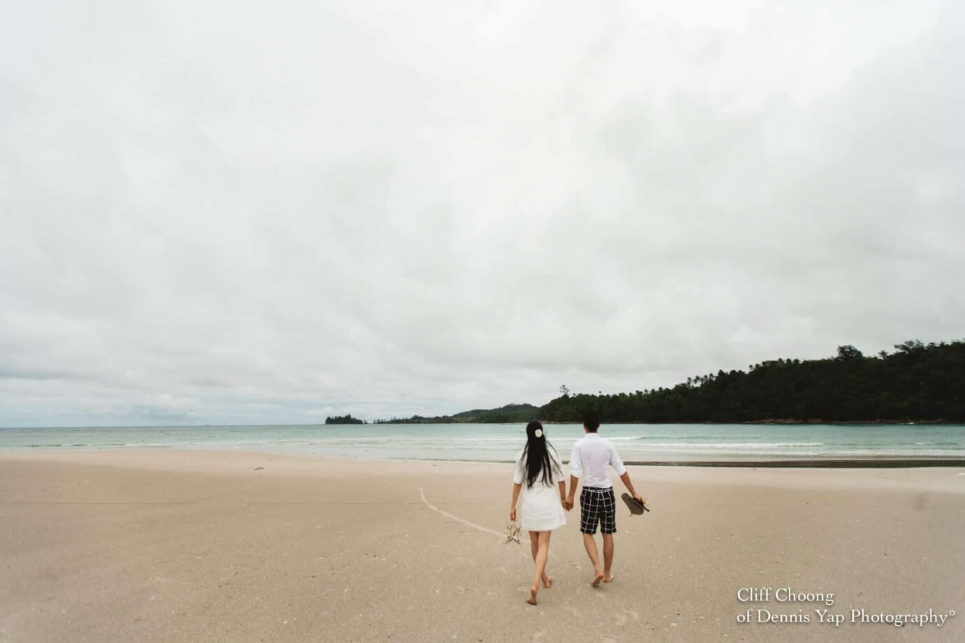 Malaysia Best Prewedding Destination Kota Kinabalu Engagement Photography Cliff Choong wedding photographer nature beach cloud blue sky kiss couple hug veil bridal gown