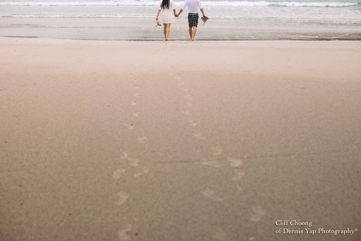 Malaysia Best Prewedding Destination Kota Kinabalu Engagement Photography Cliff Choong wedding photographer nature beach cloud blue sky kiss couple hug veil bridal gown