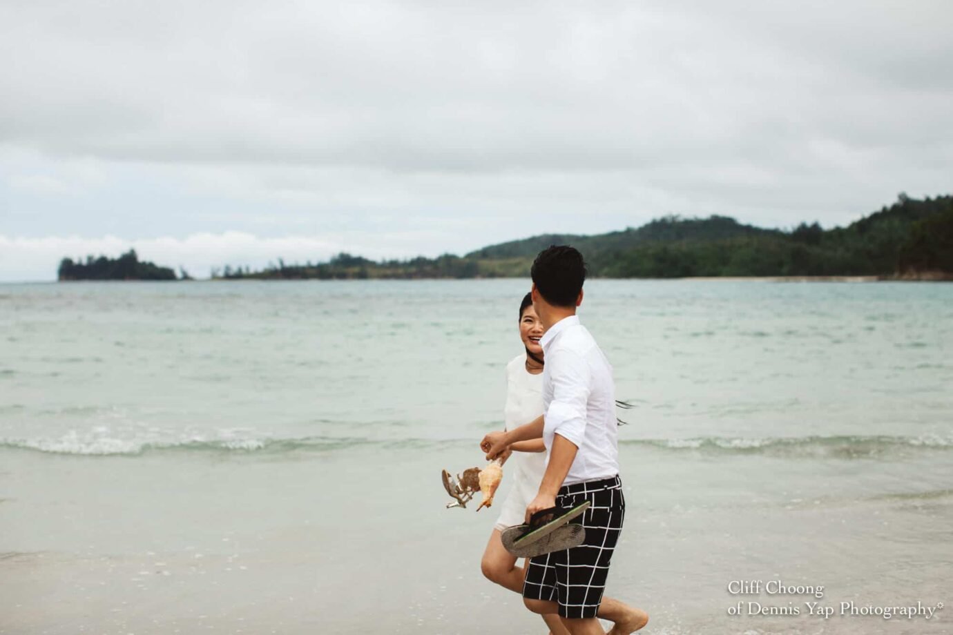 Malaysia Best Prewedding Destination Kota Kinabalu Engagement Photography Cliff Choong wedding photographer nature beach cloud blue sky kiss couple hug veil bridal gown