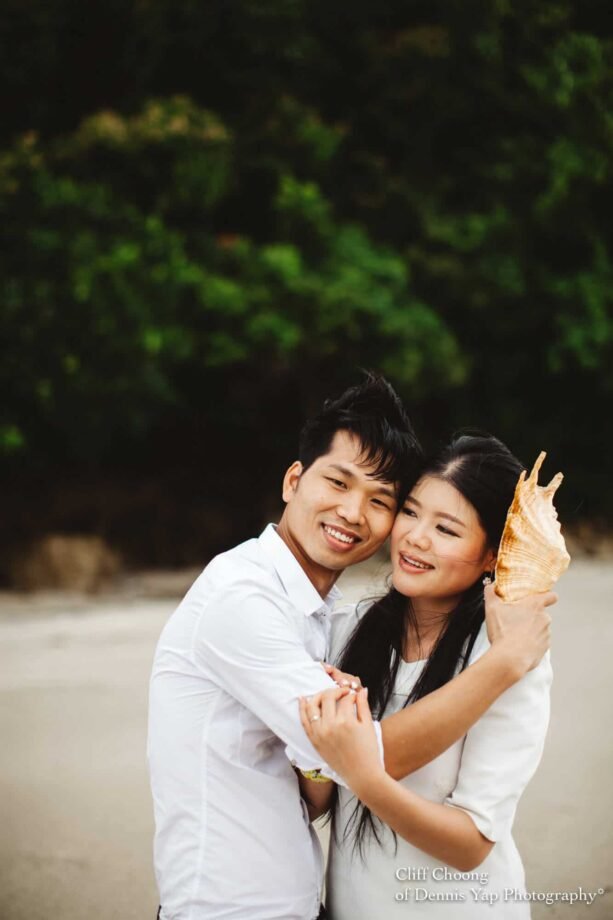 Malaysia Best Prewedding Destination Kota Kinabalu Engagement Photography Cliff Choong wedding photographer nature beach cloud blue sky kiss couple hug veil bridal gown