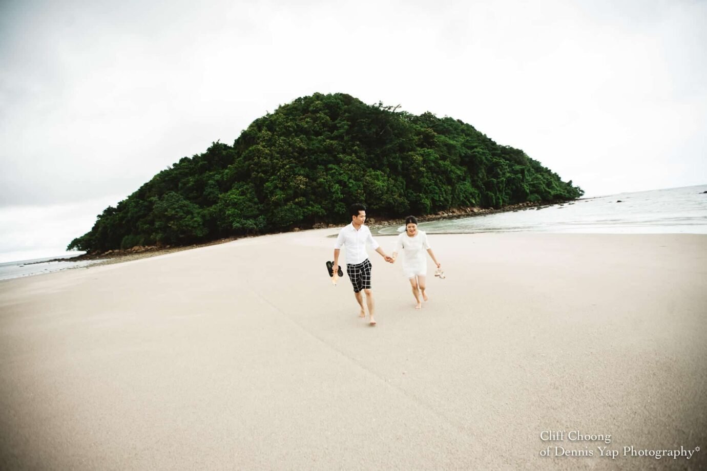 Malaysia Best Prewedding Destination Kota Kinabalu Engagement Photography Cliff Choong wedding photographer nature beach cloud blue sky kiss couple hug veil bridal gown