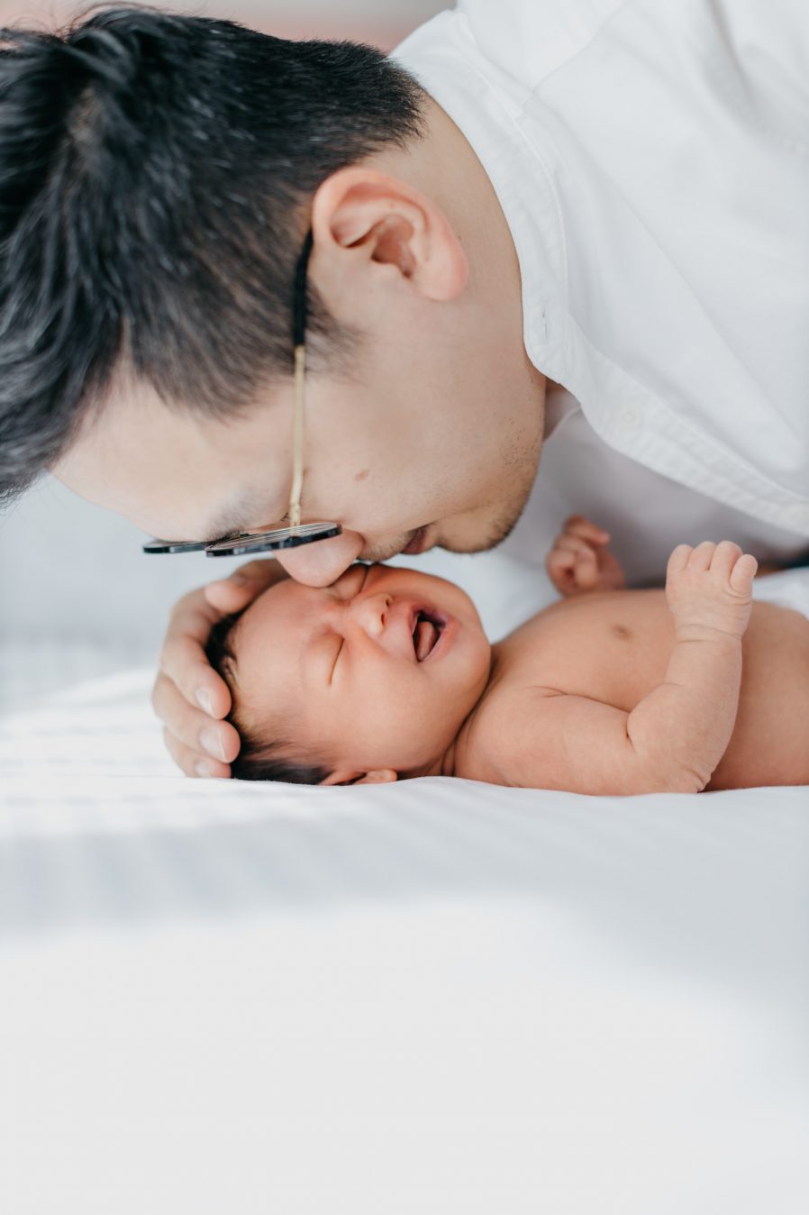 Newborn photography Kuala Lumpur father daddy kiss babybaby