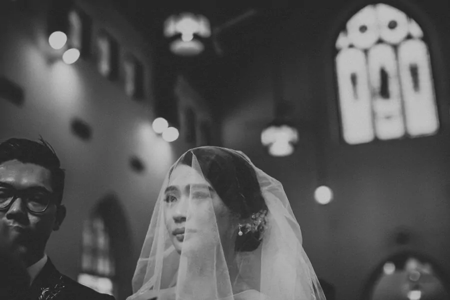 Black and white newlywed photo Wedding St. Andrew Church Kuala Lumpur Malaysia Destination Cliff Choong Photography white fairy tail beautiful wedding gown dress Classic Simple elegant 