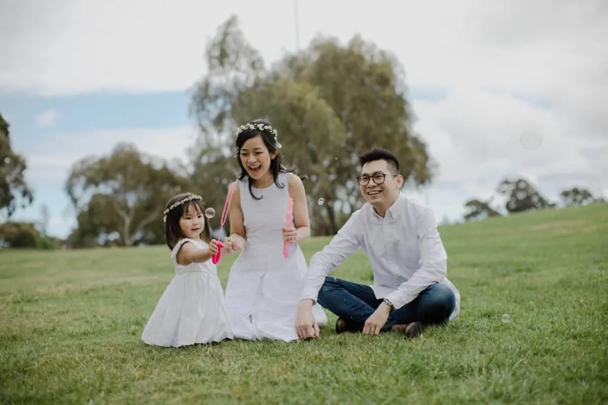 Happy Family Portrait Session With fun relax casual cozy lifestyle playful at the green park