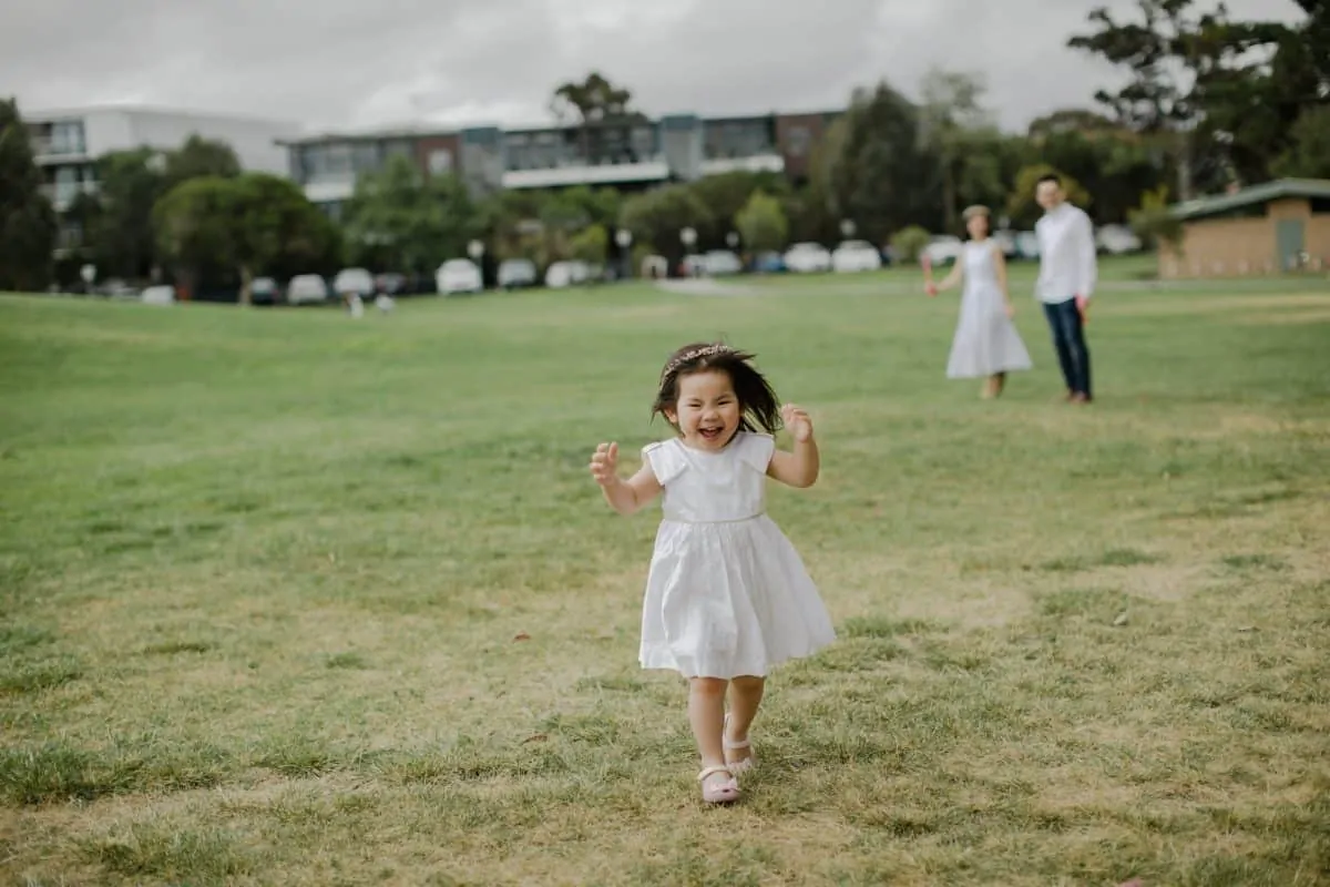 Happy Family Portrait Session With fun relax casual cozy lifestyle playful at the green park