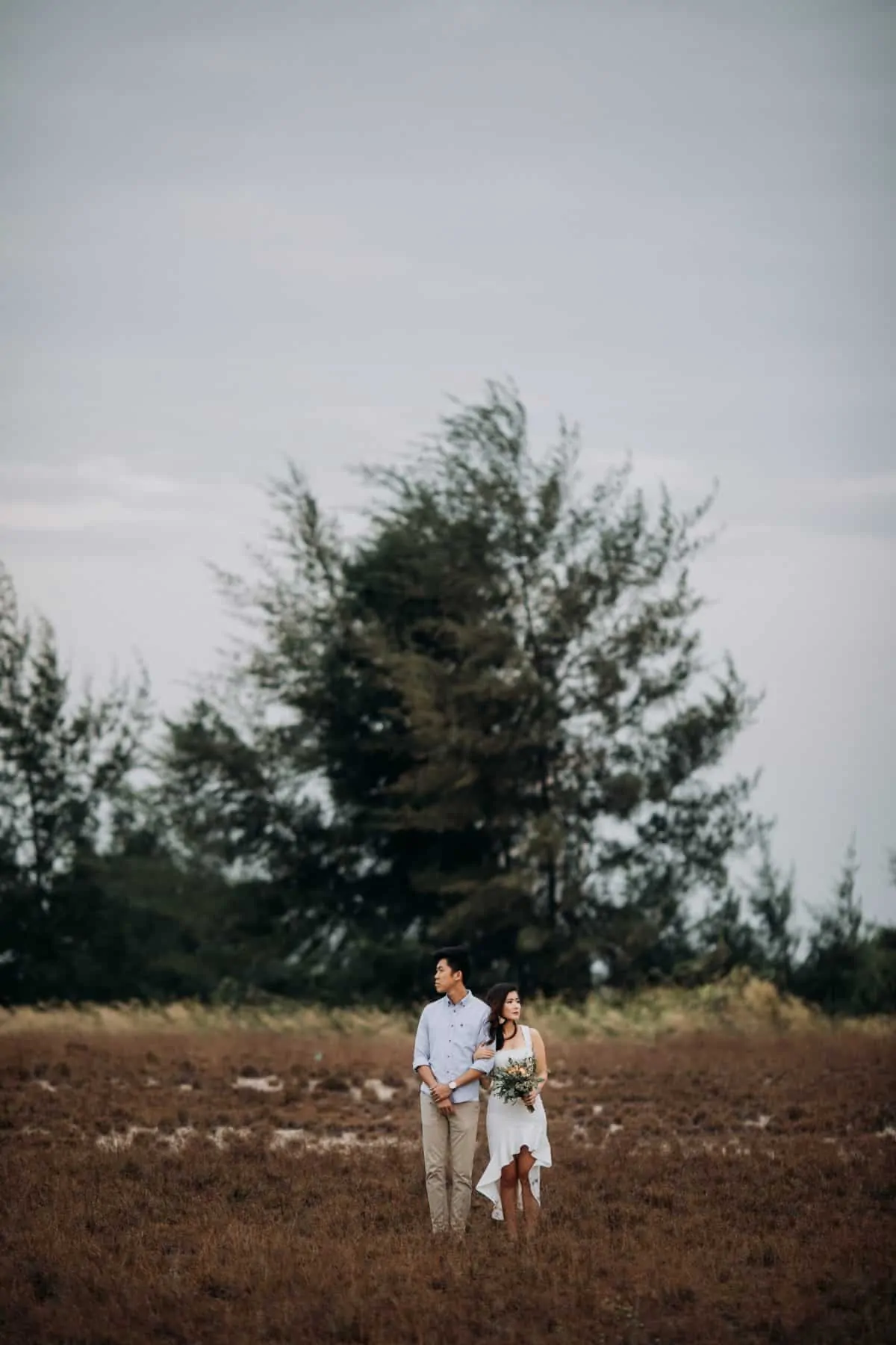 cliff choong destination portrait and wedding photographer malaysia kuala lumpur prewedding sunset golden sunrise shots bride and groom melaka desert couple kiss romantic intimate moment scene white sands