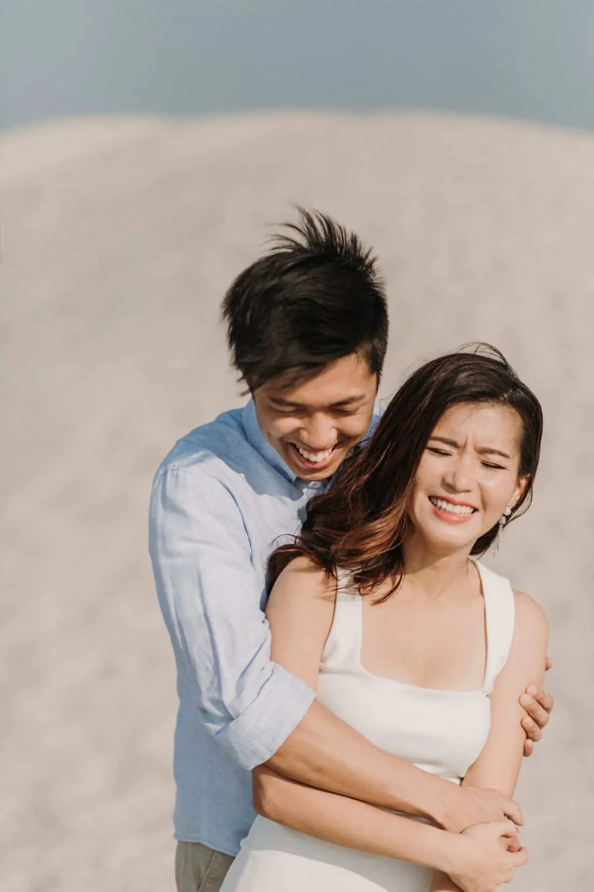cliff choong destination portrait and wedding photographer malaysia kuala lumpur prewedding sunset golden sunrise shots bride and groom melaka desert couple kiss romantic intimate moment scene white sands