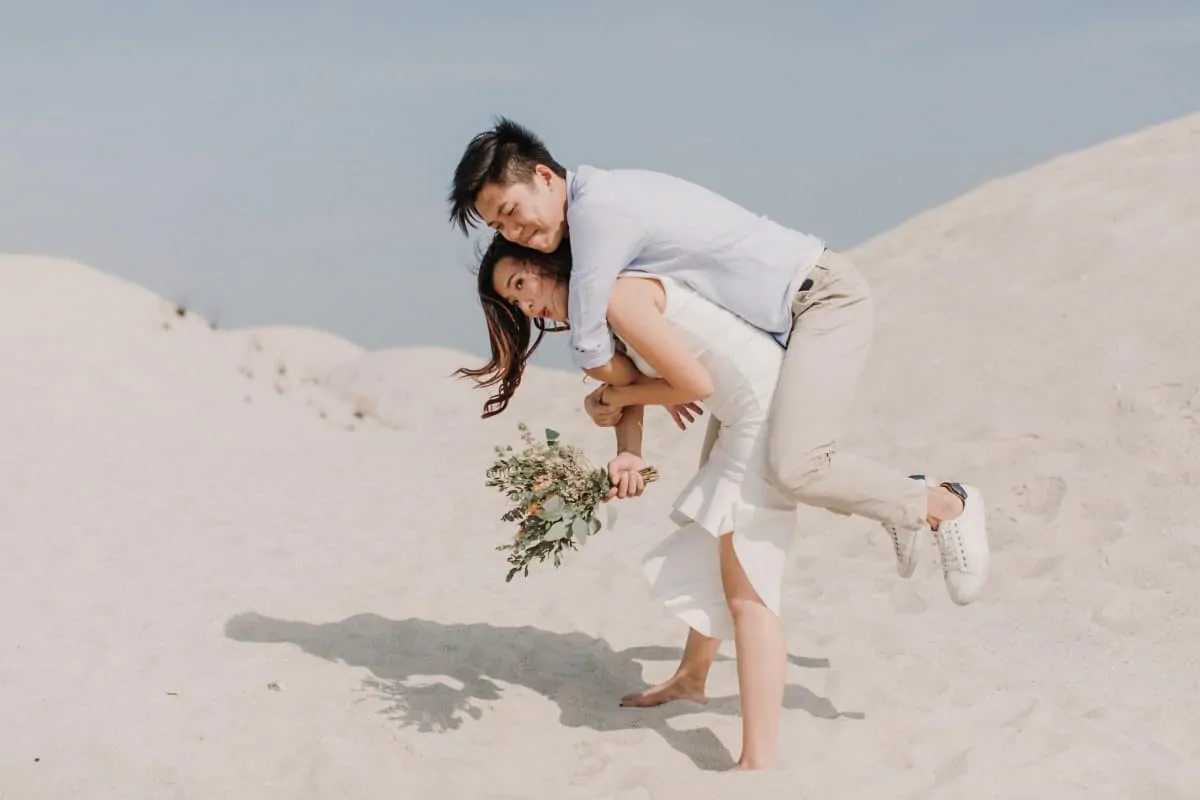 cliff choong destination portrait and wedding photographer malaysia kuala lumpur prewedding sunset golden sunrise shots bride and groom melaka desert couple kiss romantic intimate moment scene white sands