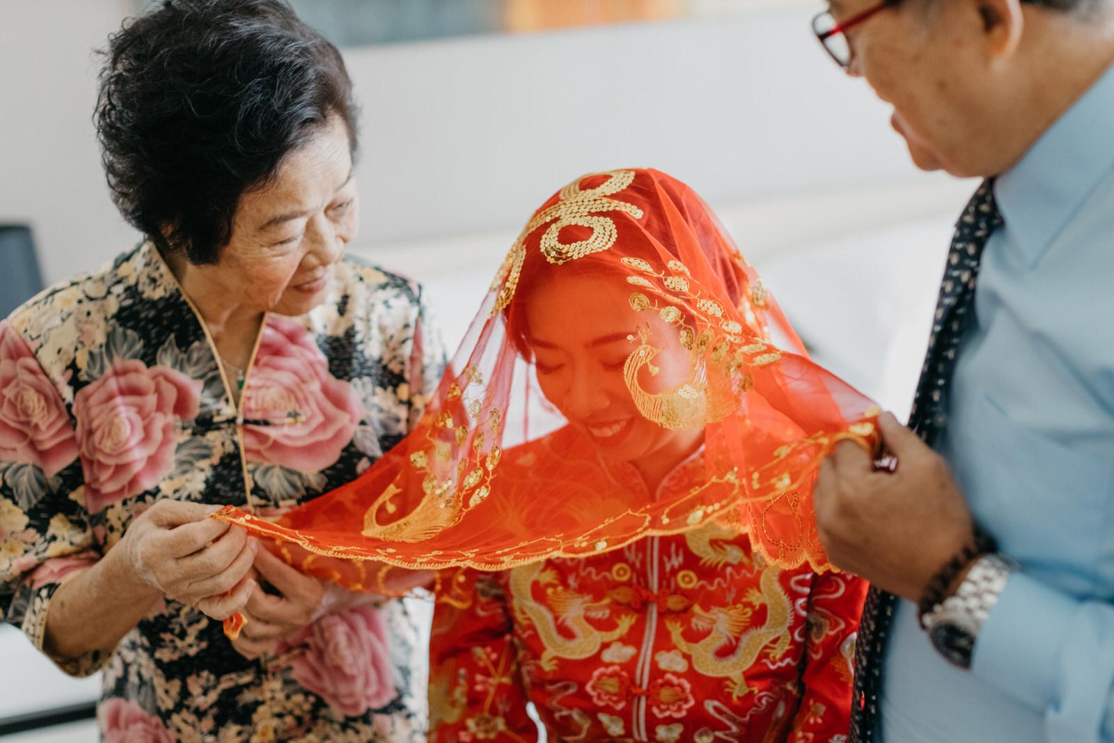 Bride on Red Chinese Kwa Red Veil Moment Shot Wedding in Kuala Lumpur