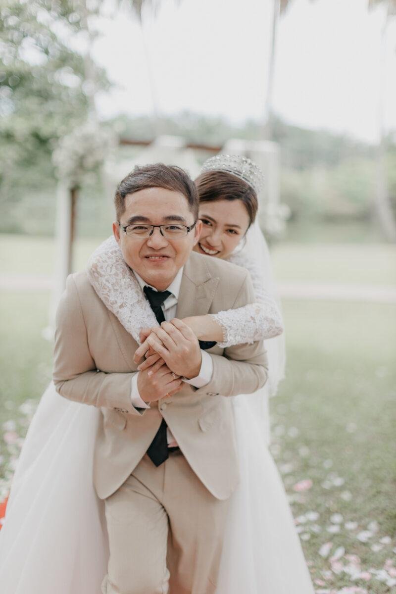 wedding couple exchange vows at a garden wedding at The Saujana Hotel Subang Jaya