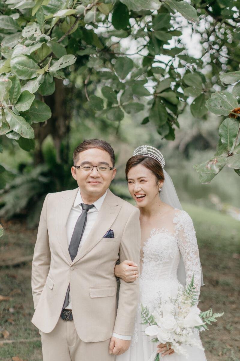 wedding couple exchange vows at a garden wedding at The Saujana Hotel Subang Jaya