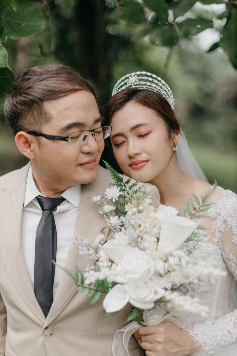 wedding couple exchange vows at a garden wedding at The Saujana Hotel Subang Jaya