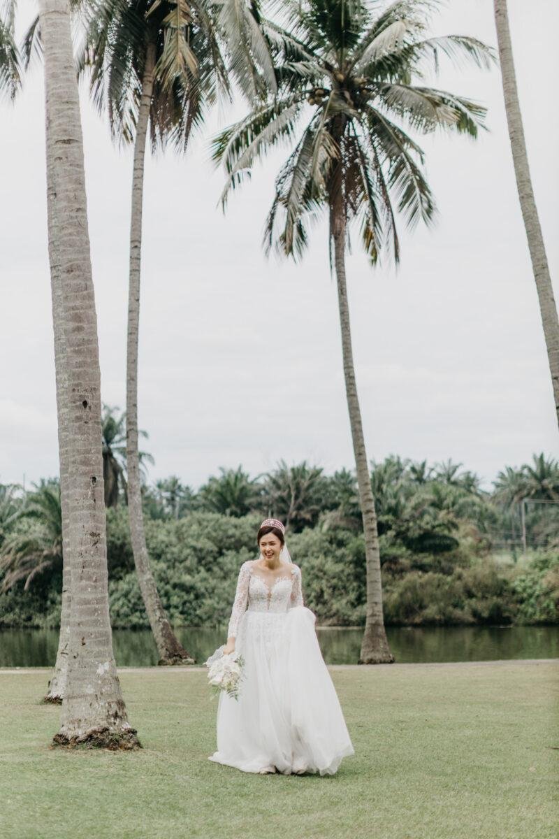 wedding couple exchange vows at a garden wedding at The Saujana Hotel Subang Jaya
