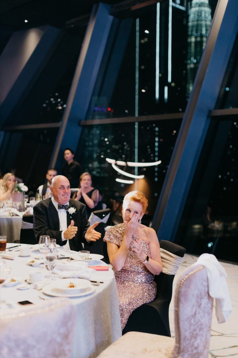 groom's parents getting emotional at Lee and Emily's wedding celebration at the Element Hotel Kuala Lumpur