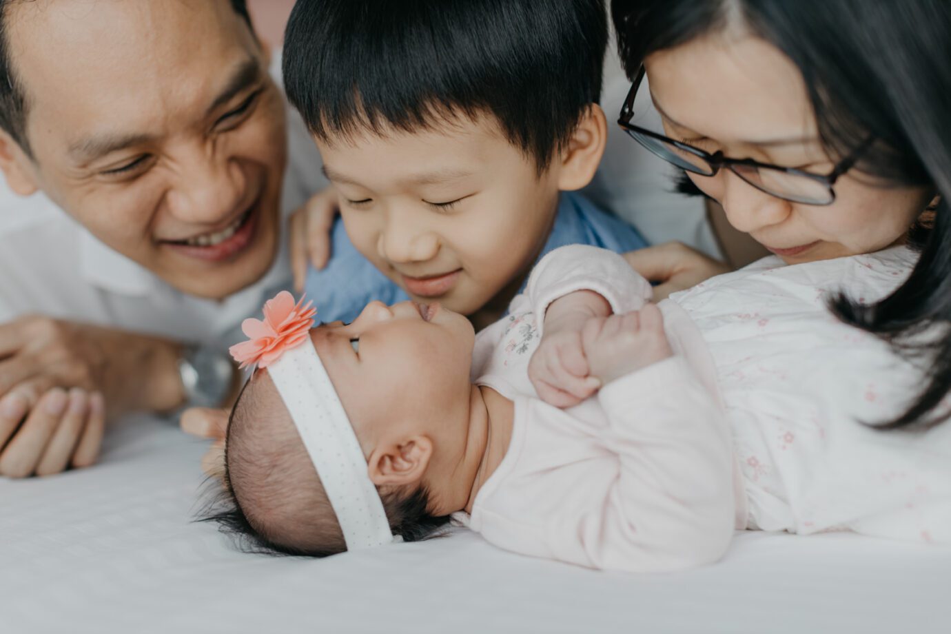 Newborn photography capturing sibling bond by cliff choong Photography Malaysia