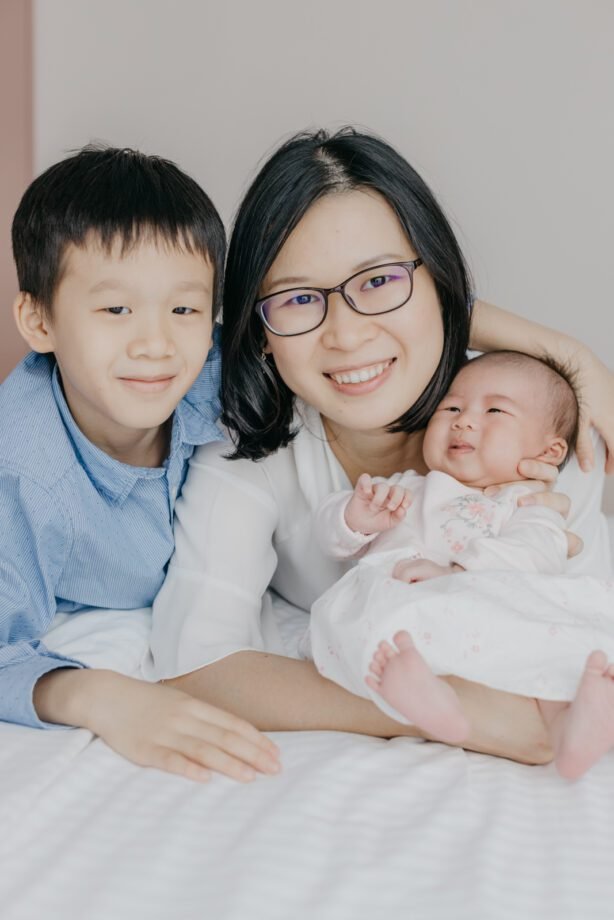 Newborn photography capturing sibling bond by cliff choong Photography Malaysia