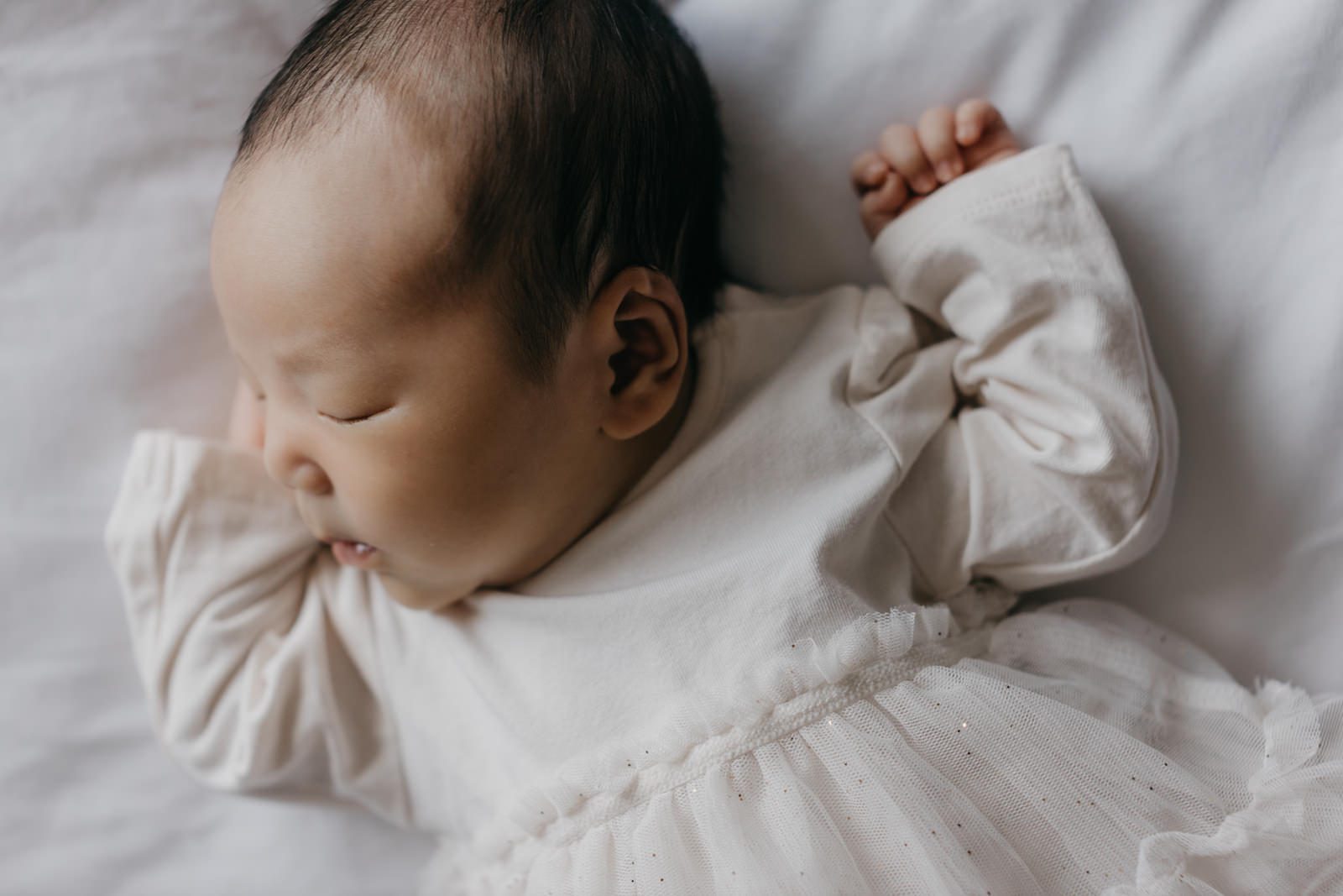 Peaceful newborn daughter, Little Kiko, sleeping soundly Newborn Photography Mini Session