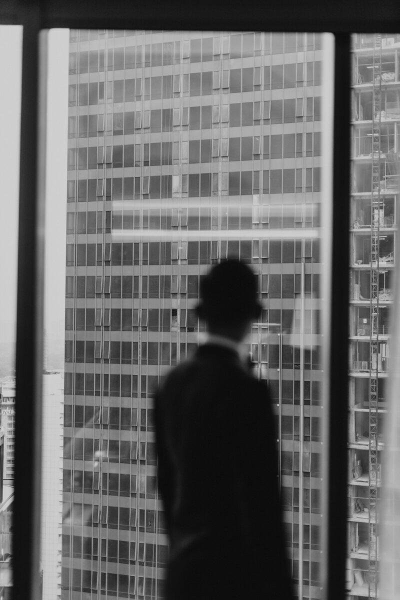 Groom getting ready. A dreamy and romantic, moon-themed wedding reception at The Equatorial Hotel Kuala Lumpur. Liyana and Carlos's love shone bright like the moon at this magical venue.