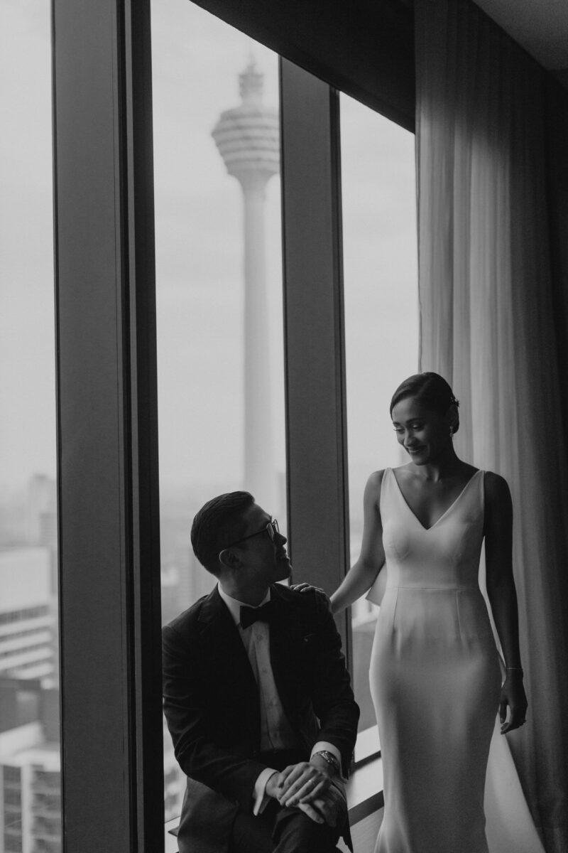 bride and groom getting ready. A dreamy and romantic, moon-themed wedding reception on the famous rooftop of The Equatorial Hotel Kuala Lumpur. Liyana and Carlos's love shone bright like the moon at this magical venue.