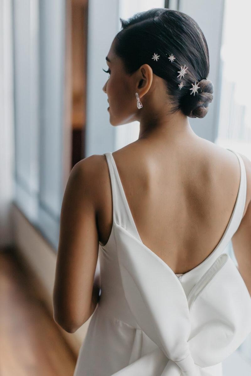 bride getting ready. A dreamy and romantic, moon-themed wedding reception on the famous rooftop of The Equatorial Hotel Kuala Lumpur. Liyana and Carlos's love shone bright like the moon at this magical venue.