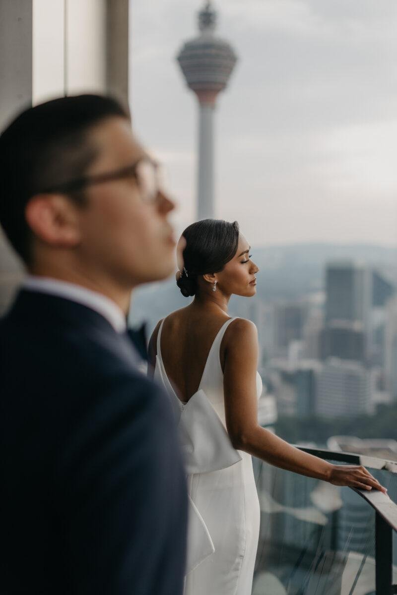 bride and groom photos on the rooftop of EQ Hotel Kuala Lumpur. A dreamy and romantic, moon-themed wedding reception on the famous rooftop of The Equatorial Hotel Kuala Lumpur. Liyana and Carlos's love shone bright like the moon at this magical venue.