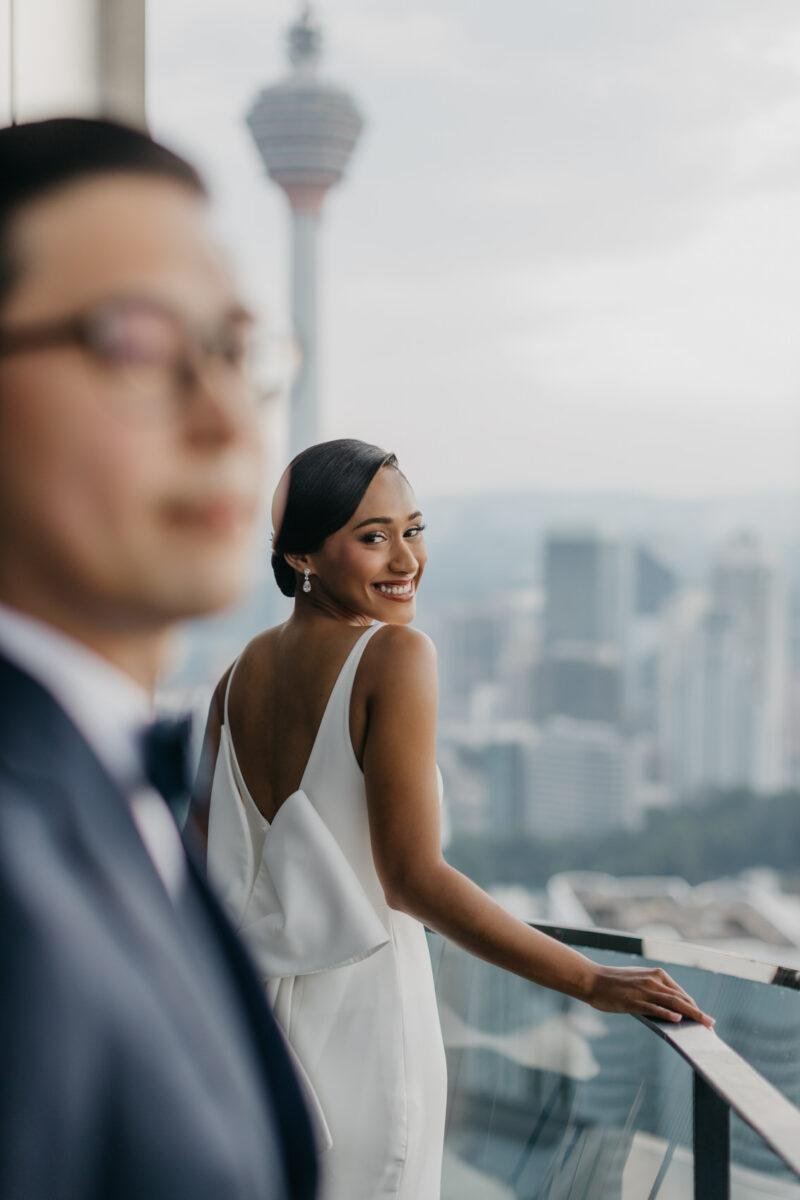bride and groom photos on the rooftop of EQ Hotel Kuala Lumpur. A dreamy and romantic, moon-themed wedding reception on the famous rooftop of The Equatorial Hotel Kuala Lumpur. Liyana and Carlos's love shone bright like the moon at this magical venue.