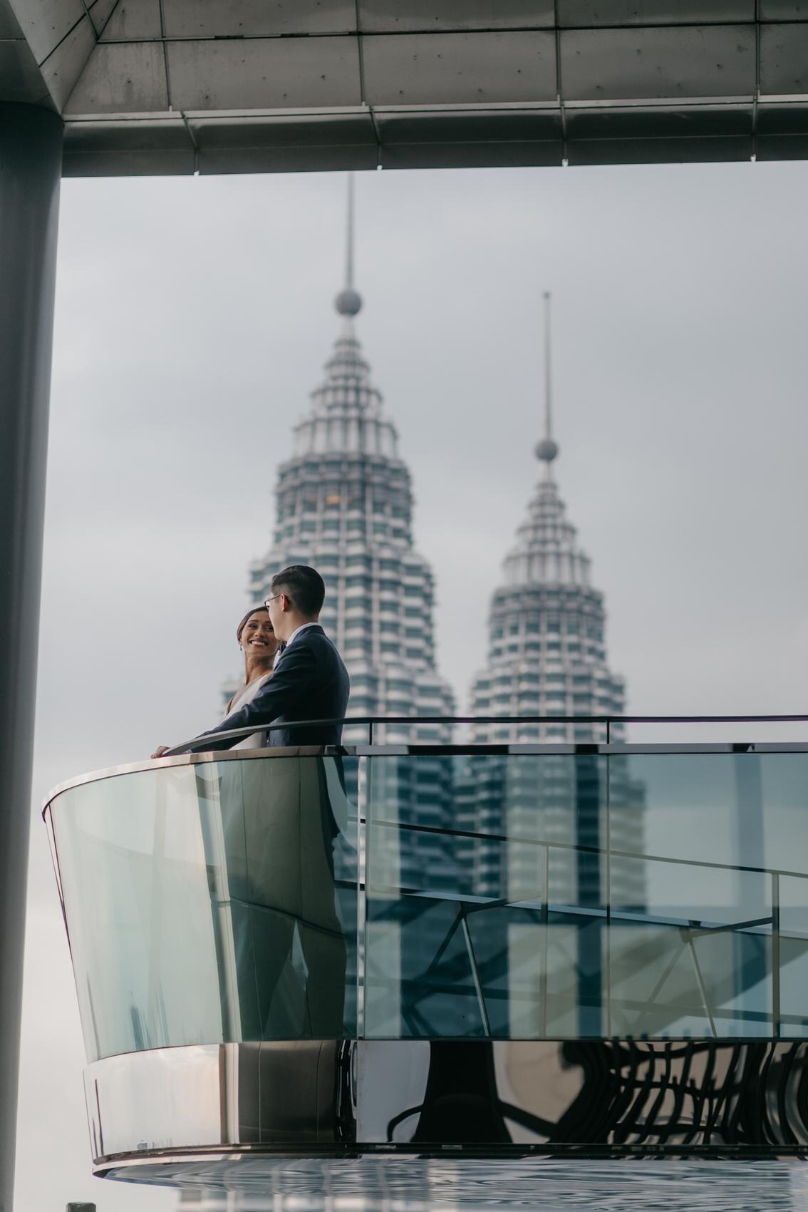 bride and groom photos on the rooftop of EQ Hotel Kuala Lumpur. A dreamy and romantic, moon-themed wedding reception on the famous rooftop of The Equatorial Hotel Kuala Lumpur. Liyana and Carlos's love shone bright like the moon at this magical venue.