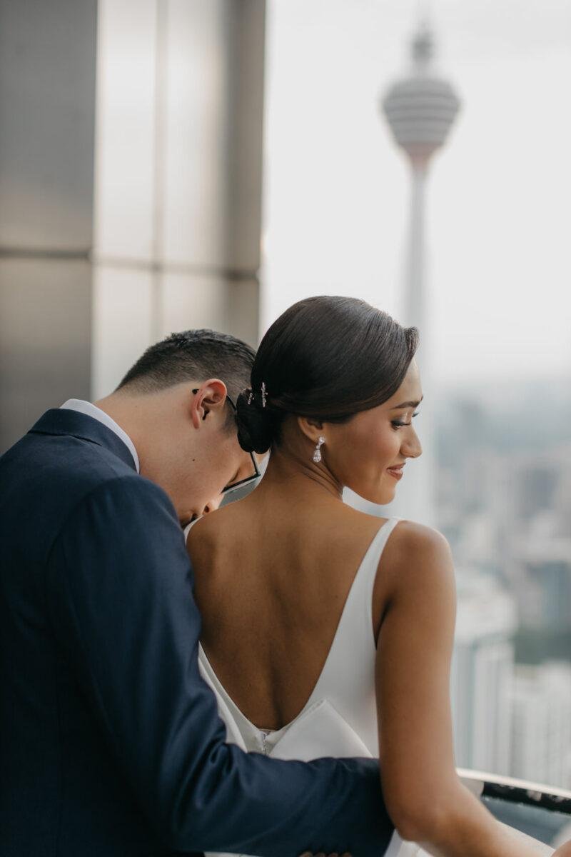 bride and groom photos on the rooftop of EQ Hotel Kuala Lumpur. A dreamy and romantic, moon-themed wedding reception on the famous rooftop of The Equatorial Hotel Kuala Lumpur. Liyana and Carlos's love shone bright like the moon at this magical venue.