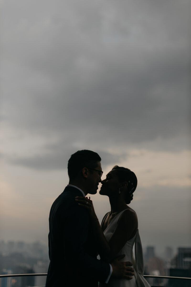 bride and groom photos on the rooftop of EQ Hotel Kuala Lumpur with KL tower as a backdrop. A dreamy and romantic, moon-themed wedding reception on the famous rooftop of The Equatorial Hotel Kuala Lumpur. Liyana and Carlos's love shone bright like the moon at this magical venue.