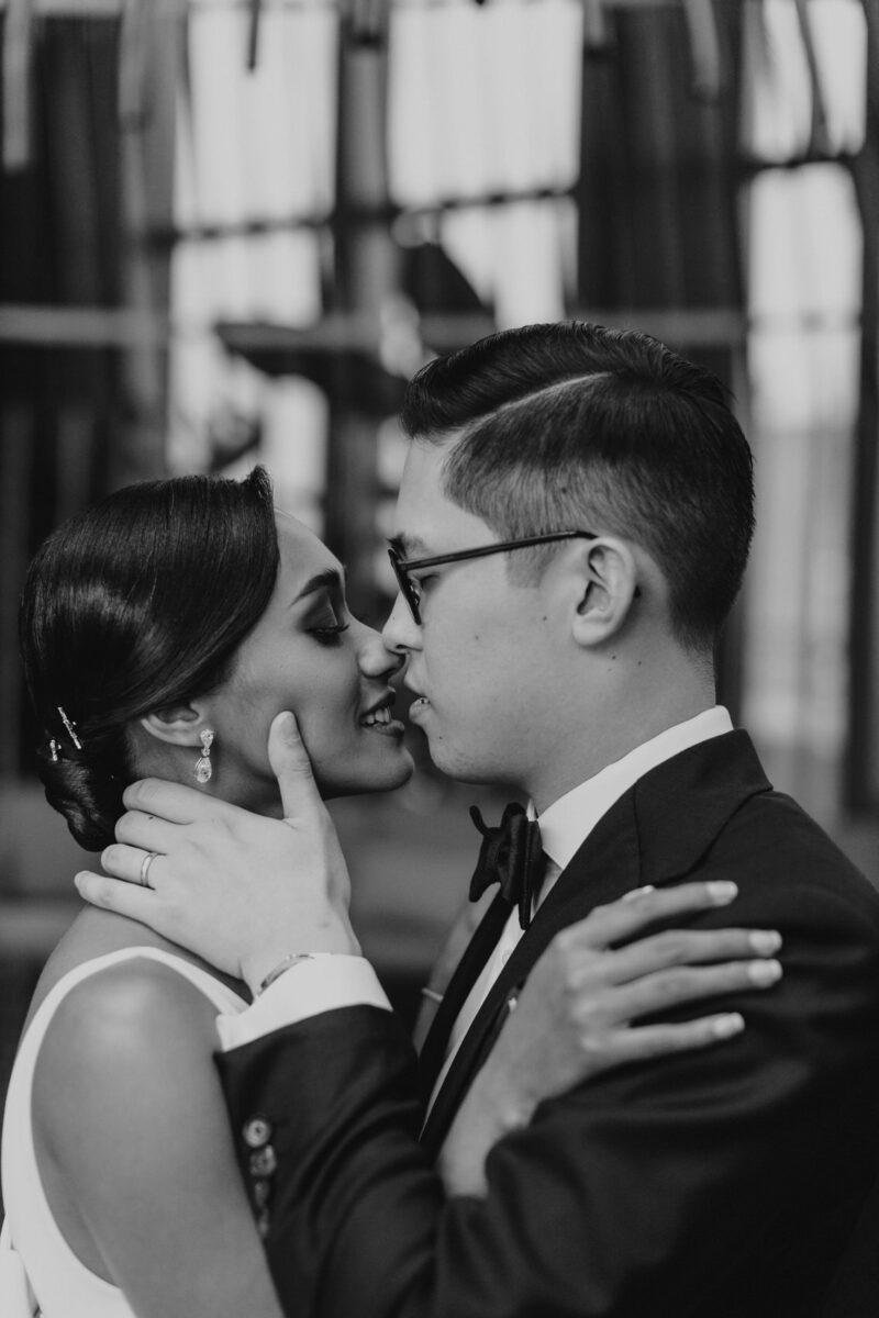 bride and groom photos on the rooftop of EQ Hotel Kuala Lumpur with KL tower as a backdrop. A dreamy and romantic, moon-themed wedding reception on the famous rooftop of The Equatorial Hotel Kuala Lumpur. Liyana and Carlos's love shone bright like the moon at this magical venue.
