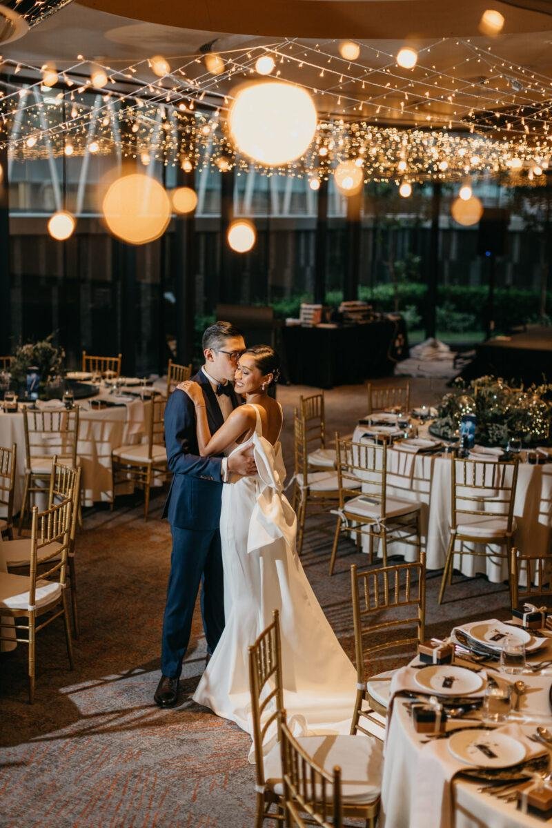 Liyana and Carlos in their wedding attire at The Equatorial Hotel Kuala Lumpur. A dreamy and romantic, celestial moon-themed wedding reception at The Equatorial Hotel Kuala Lumpur. Liyana and Carlos's love shone bright like the moon at this magical venue.