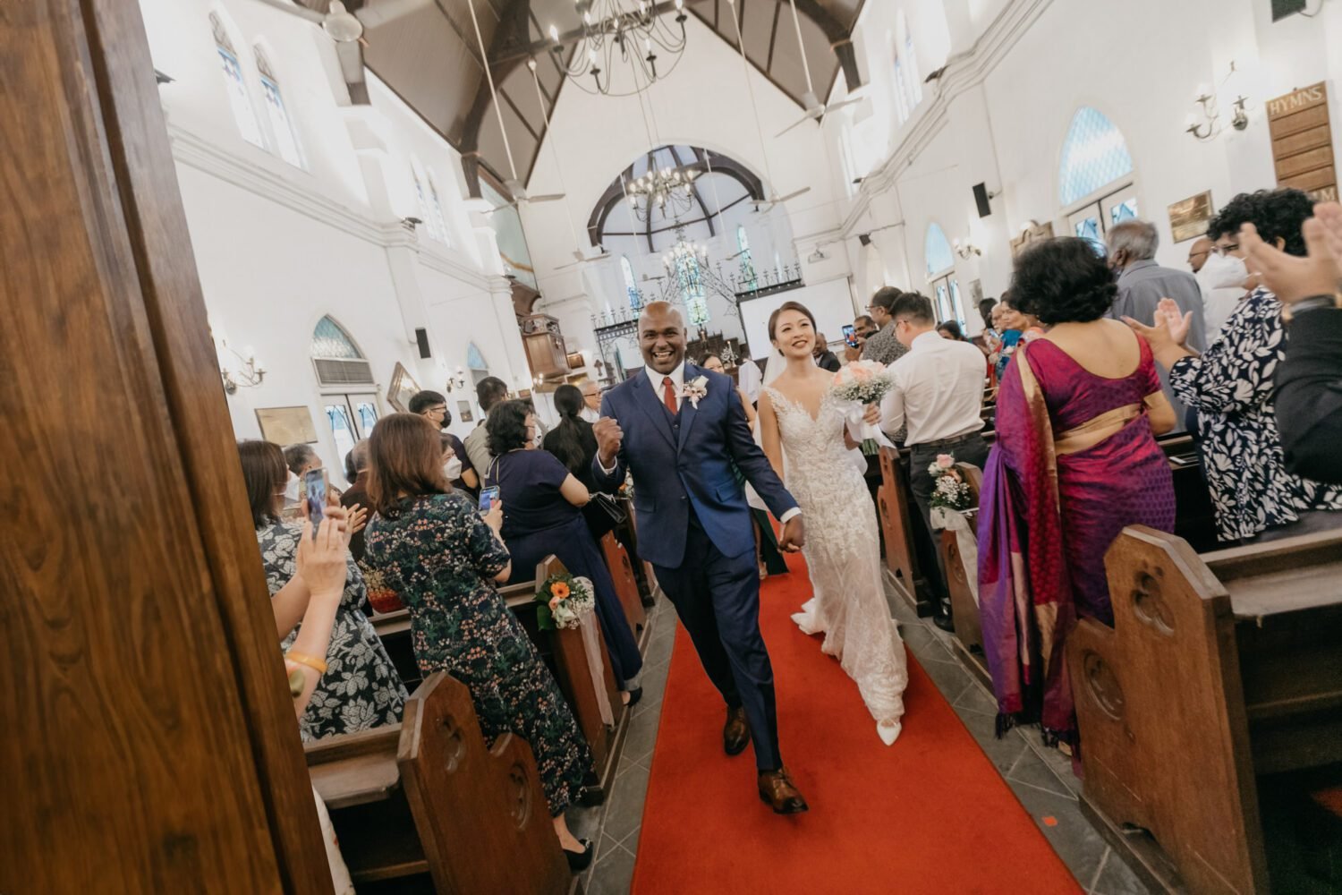 Bride and groom marching out of church wedding at St Mary's Cathedral Kuala Lumpur Love, democracy, and everlasting memories, Malaysia 15th General Election Day, Cliff Choong Photography