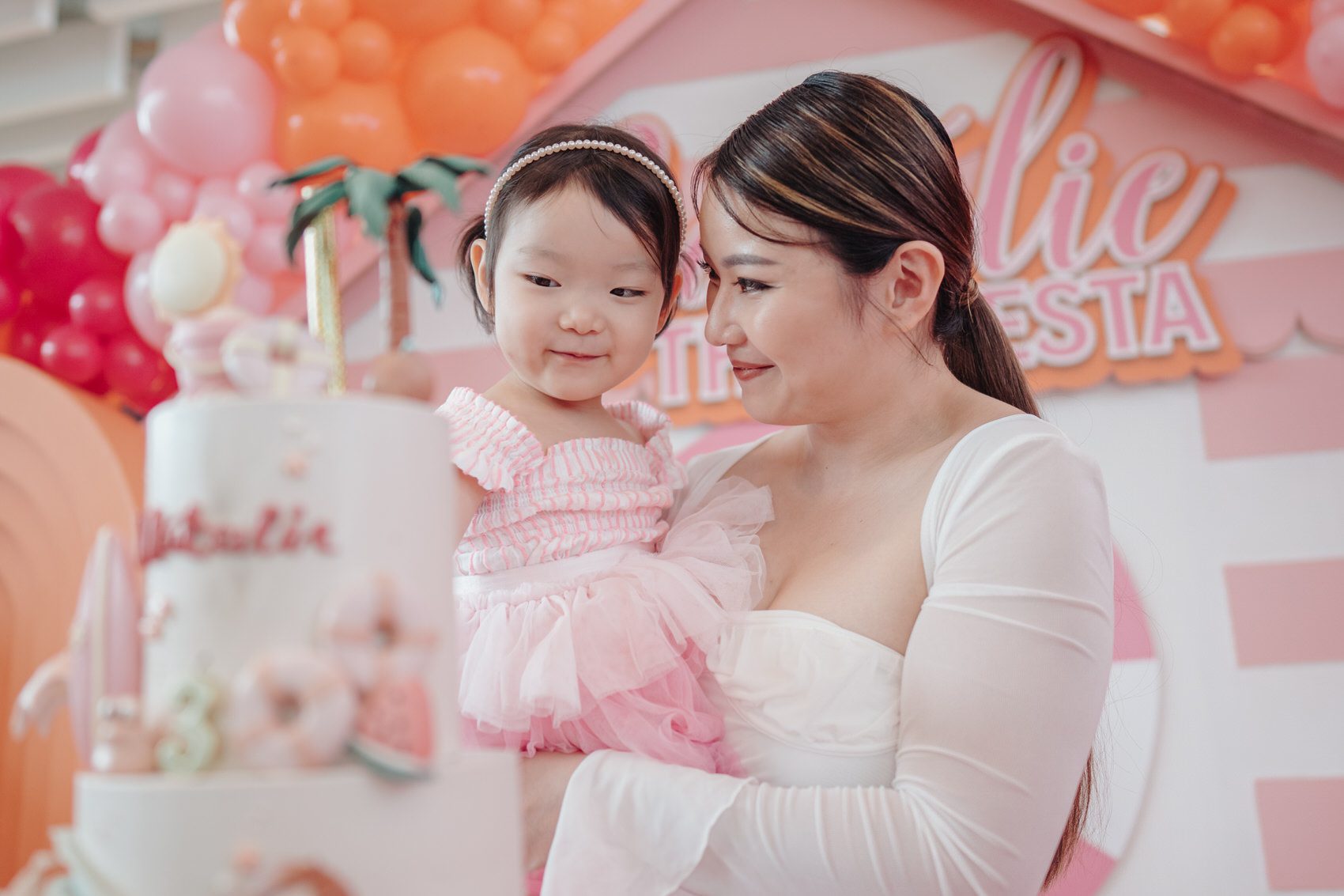 Photo of Natalie and mommy 3 year old birthday party celebration photography at Kuala Lumpur. mermaid pink barbie beach theme. by Cliff Choong Photography