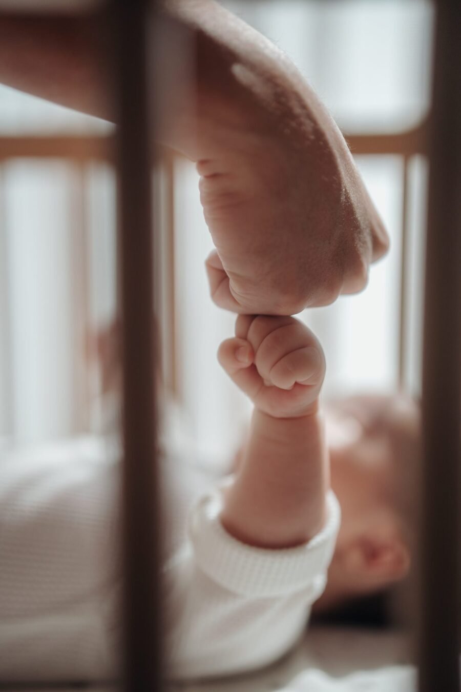 Father and baby fist bump during 100th Day Baby Celebration