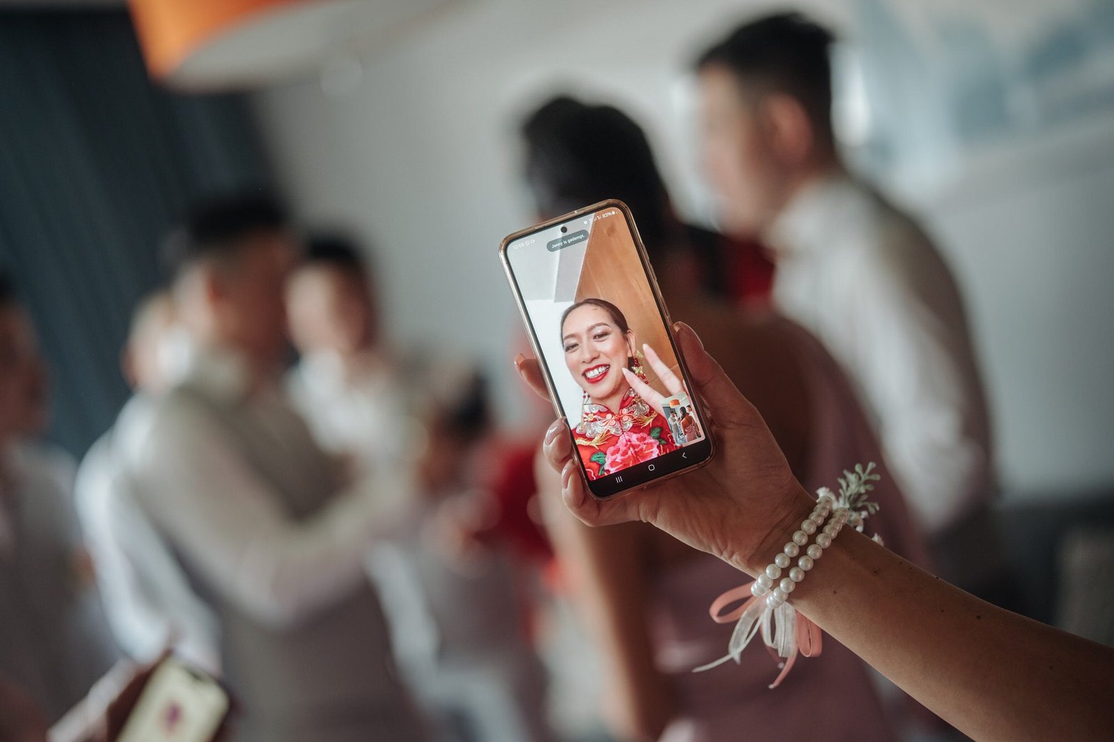 Bride smiling as the groom successfully completes the final gate-crashing challenge at their Chinese traditional wedding in Rotterdam.