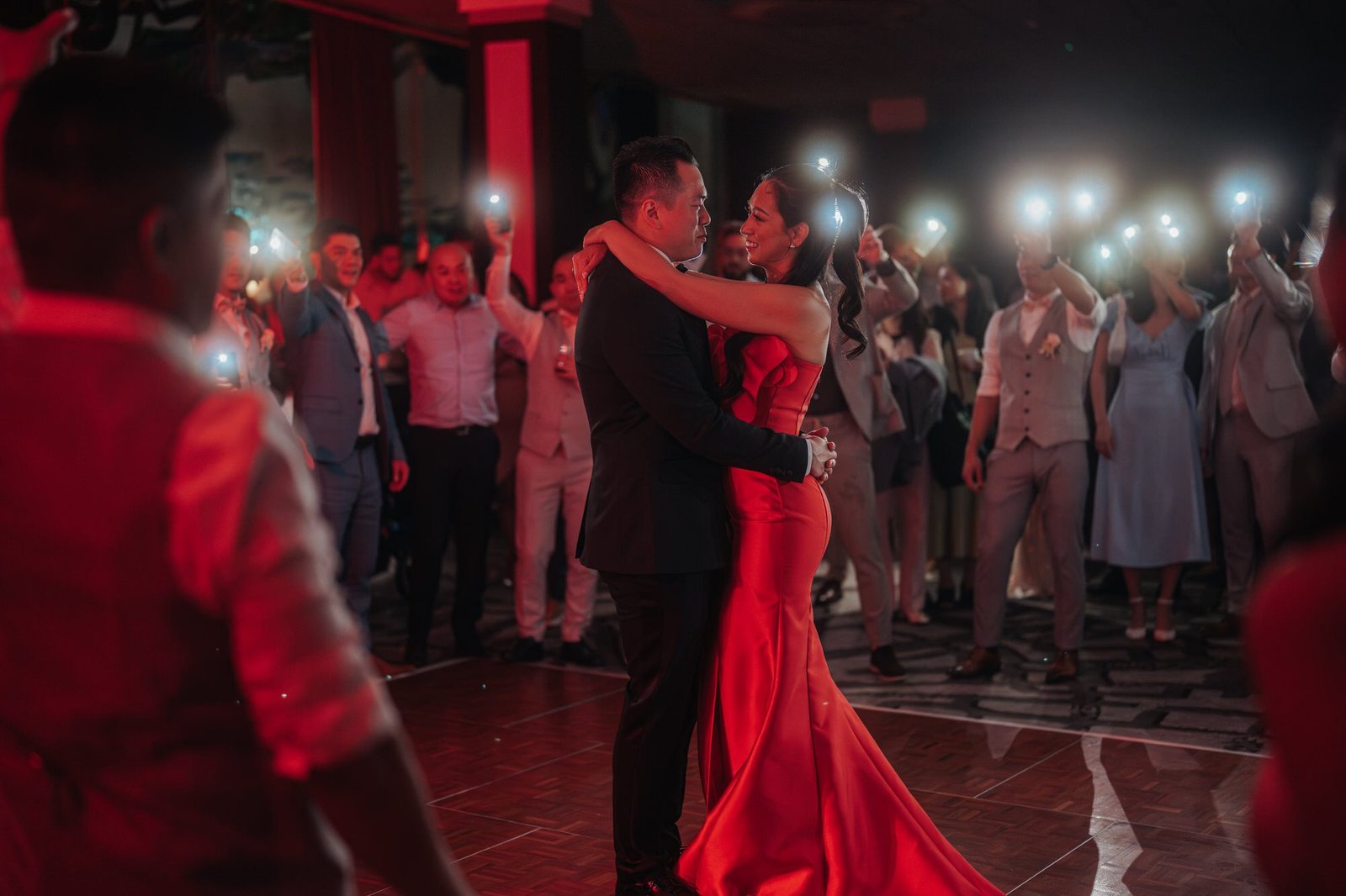 Groom serenading his bride with a heartfelt song during their wedding reception in Hilton Rotterdam, photographed by Cliff Choong Photography.