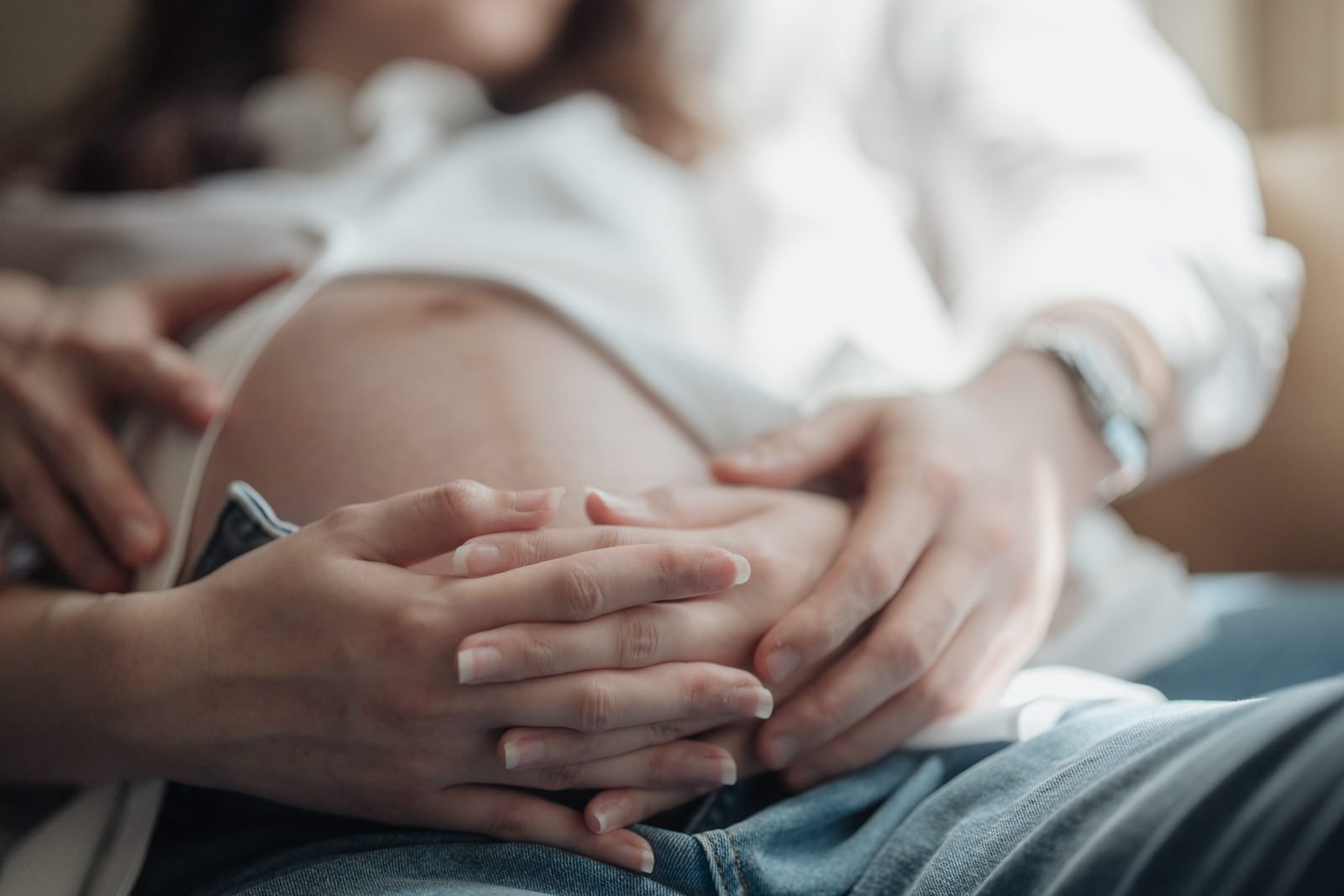 RuYiin and Shawn in a maternity portrait session at JW Marriott Hotel Kuala Lumpur, bathed in natural light