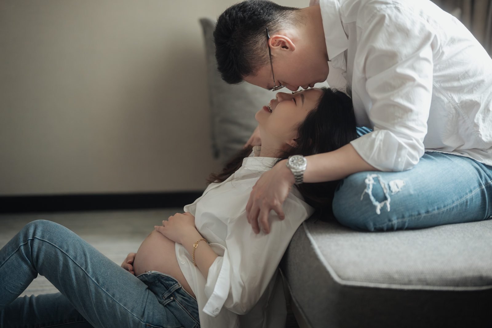 Candid shot of RuYiin during a maternity portrait session at JW Marriott Hotel Kuala Lumpur, filled with anticipation.