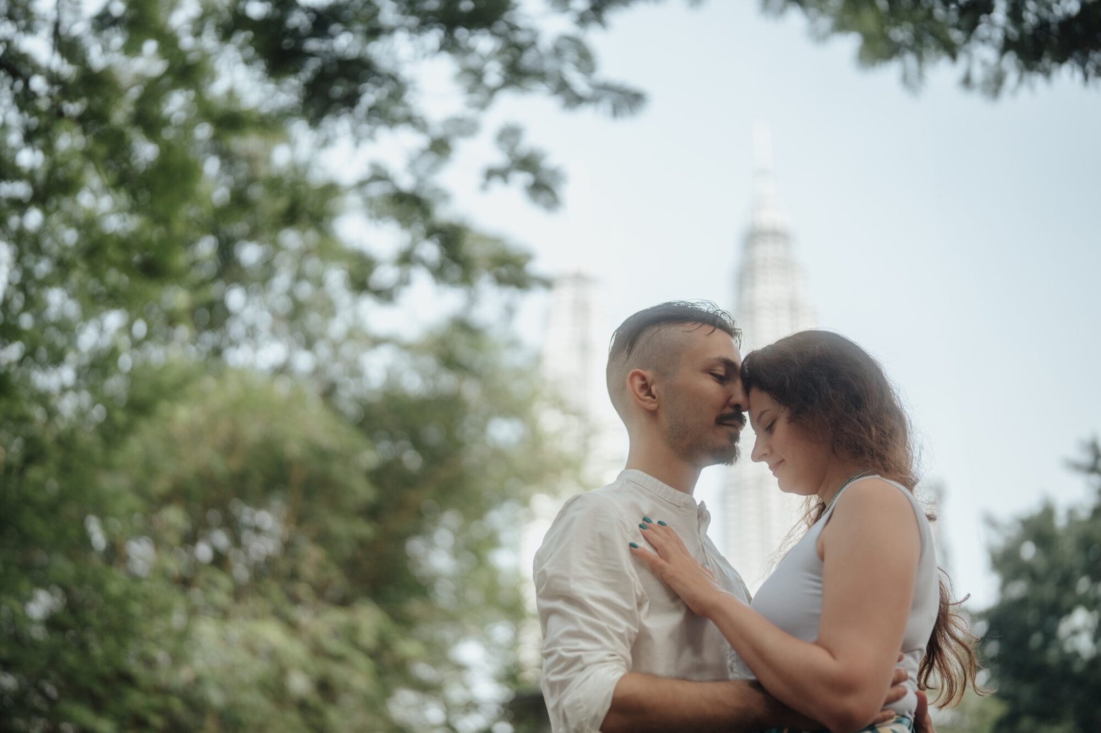 KLCC couple shoot wide architectural frame