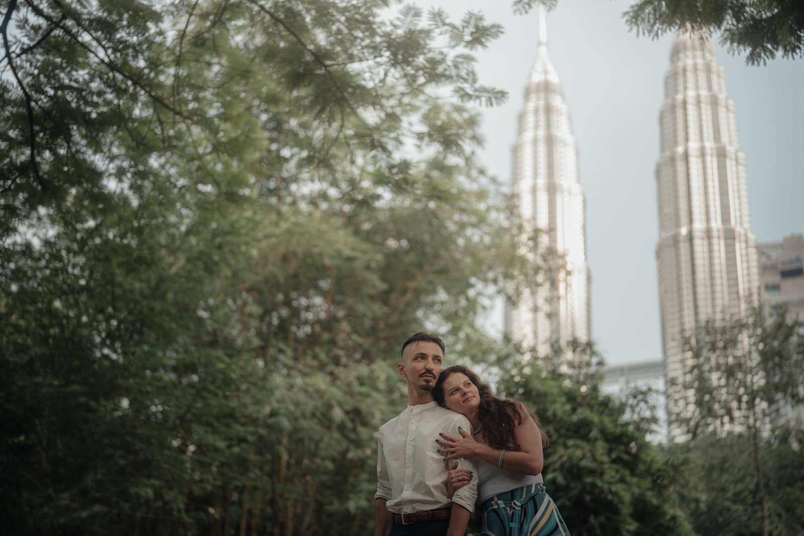 KL couple portrait morning light by heritage arches KLCC
