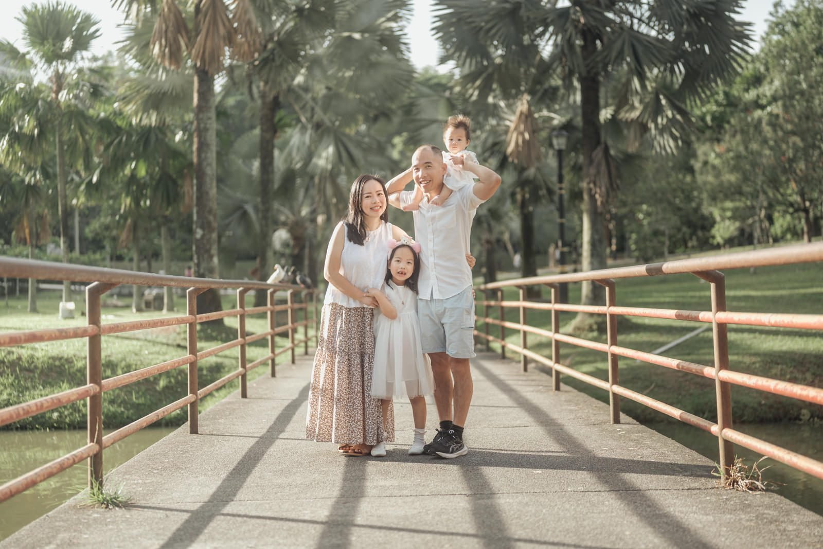 Family photos Kuala Lumpur in a park during golden hour