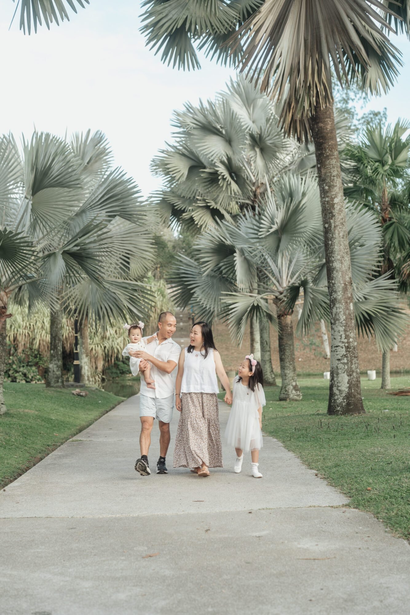 Outdoor family photos kuala lumpur Malaysia with playful kids