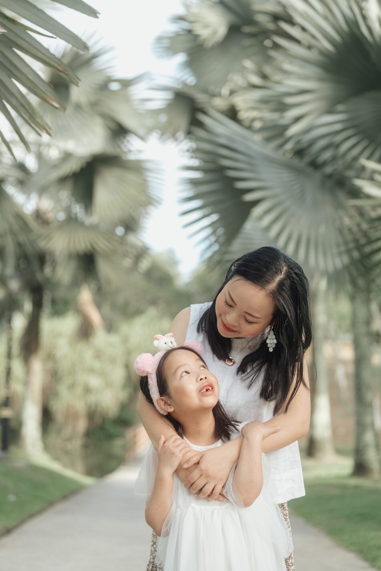 Parents holding hands with children during outdoor session