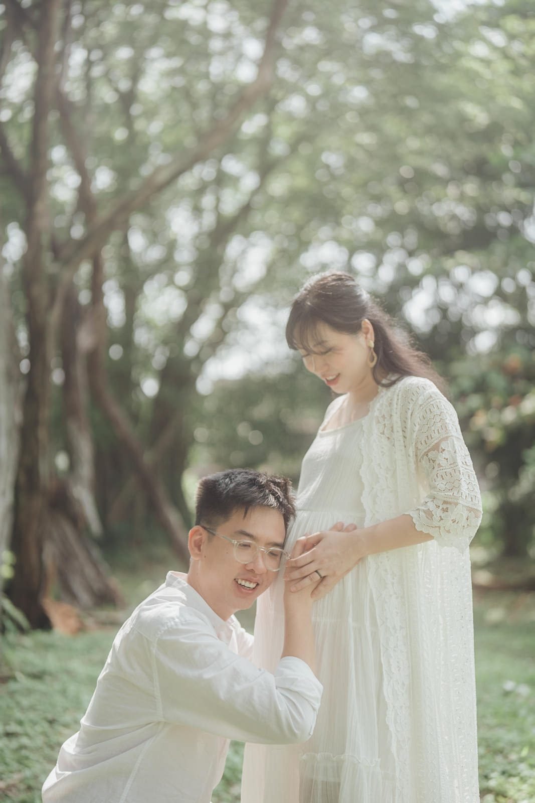 Maternity portrait surrounded by lush greenery in KL
