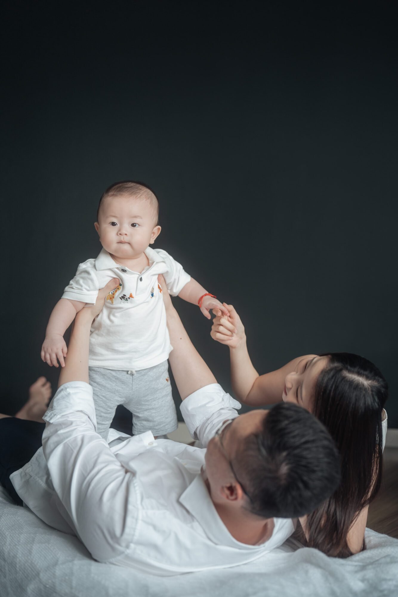 Parent–baby bonding moment during family photography in KL
