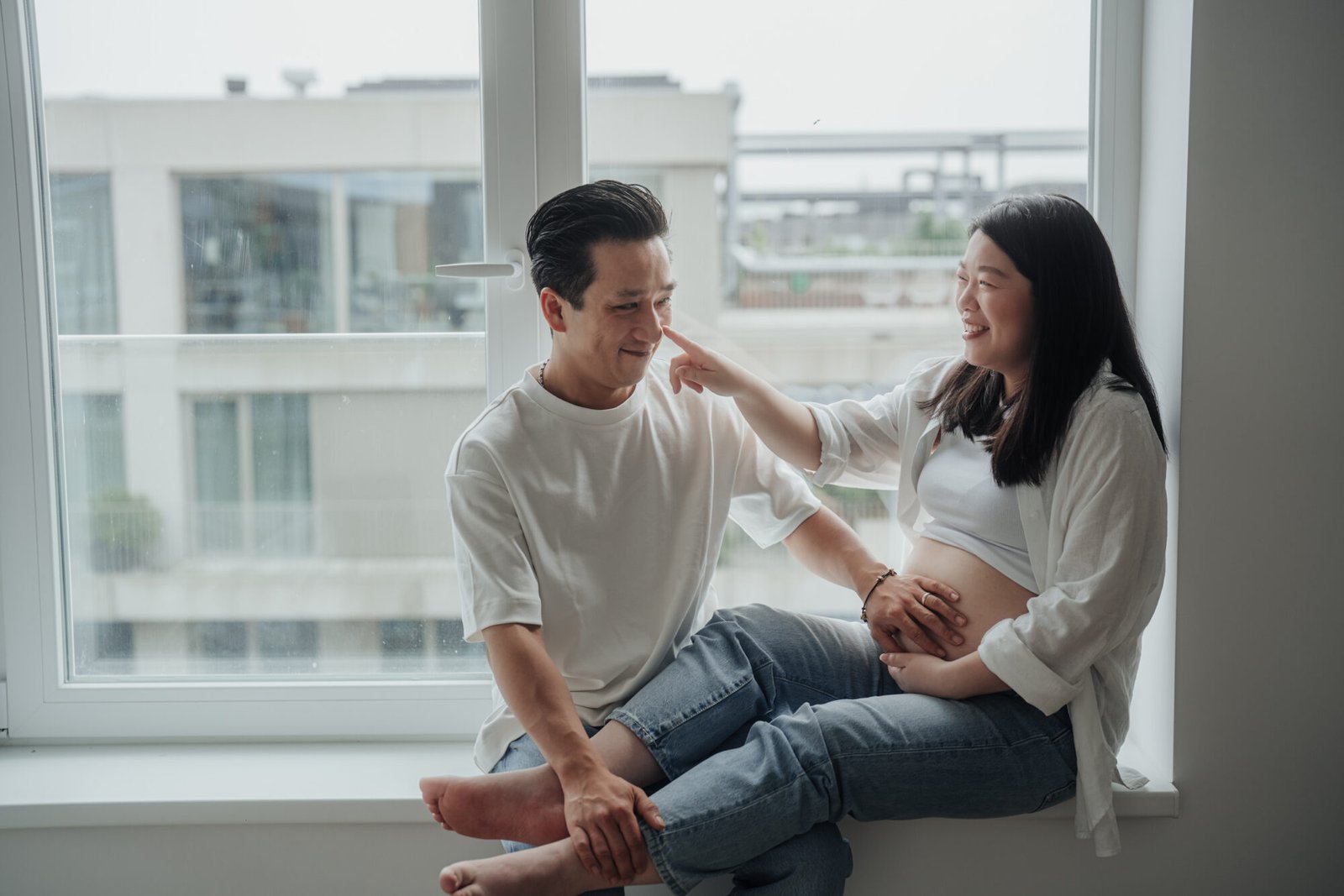Amsterdam maternity portrait with a warm candid interaction